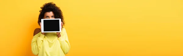 African American Woman Covering Face Digital Tablet Blank Screen Yellow — Stock Photo, Image