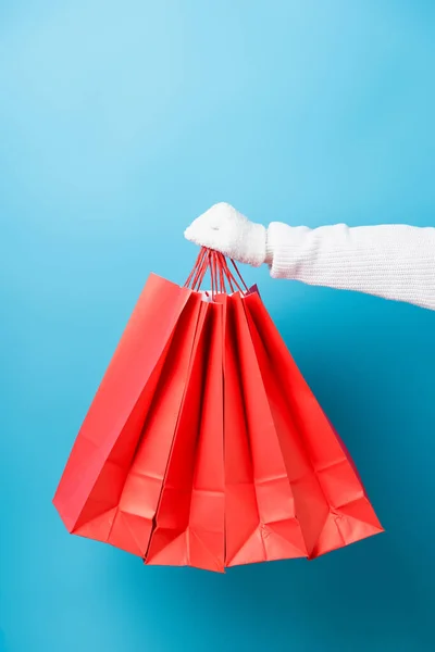 Cropped View Customer White Glove Holding Shopping Bags Blue — Stock Photo, Image