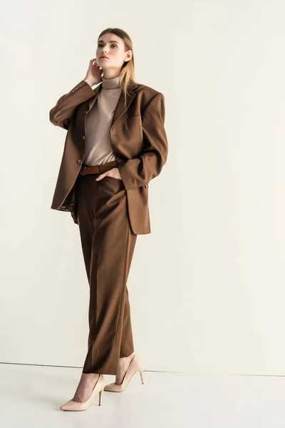 Full Length Blonde Woman Stylish Brown Suit Looking Camera While — Stock Photo, Image