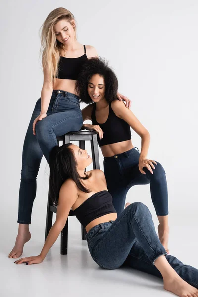 Happy Interracial Women Denim Jeans Looking Each Other While Posing — Stock Photo, Image