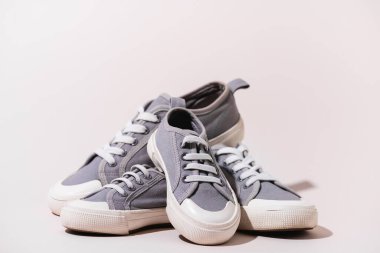 grey casual sneakers on white background clipart