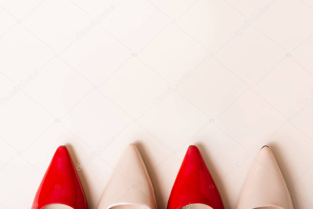 top view of leather heeled shoes on beige background