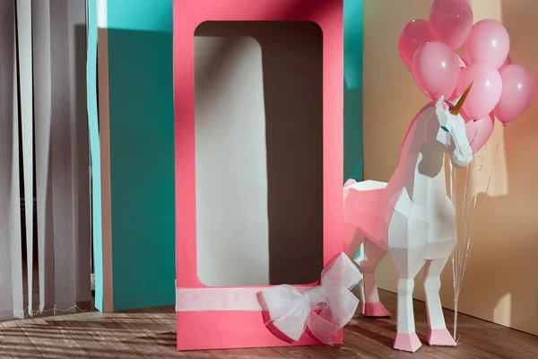 Empty pink decorative box with bow and unicorn with pink balloons — Stock Photo