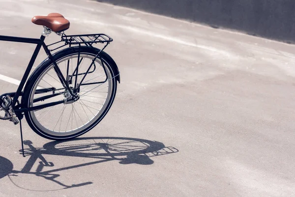 Close up view of retro bicycle parked on street — Stock Photo