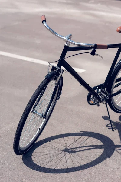 Close up view of retro bicycle parked on street — Stock Photo