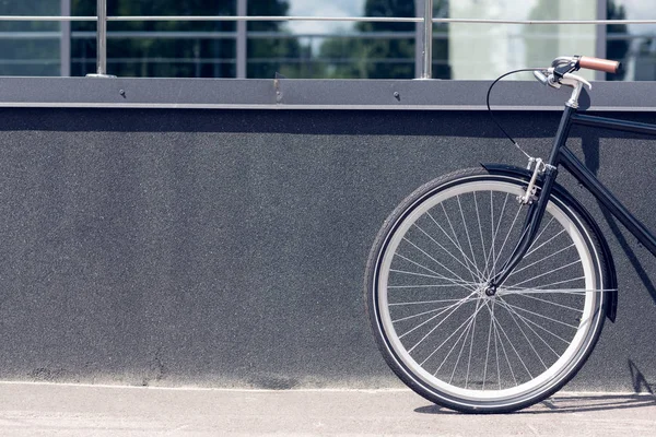 Close up view of retro bicycle parked on street — Stock Photo