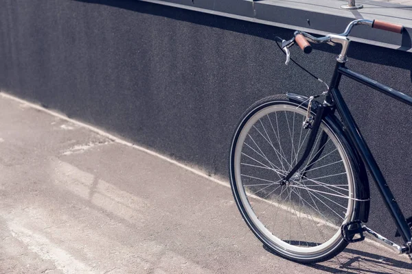 Close up view of retro bicycle parked on street — Stock Photo