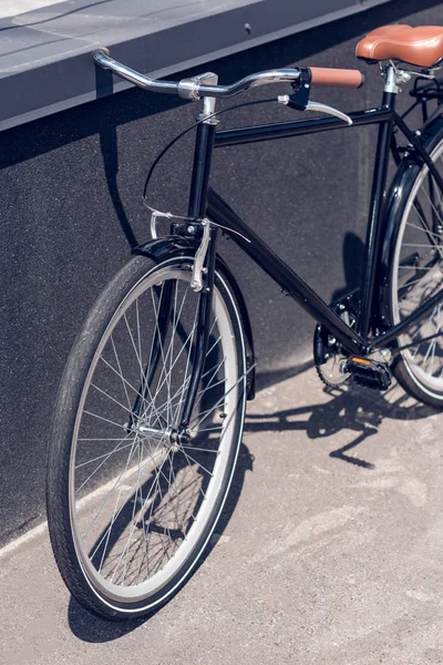 Close up view of retro bicycle parked on street — Stock Photo