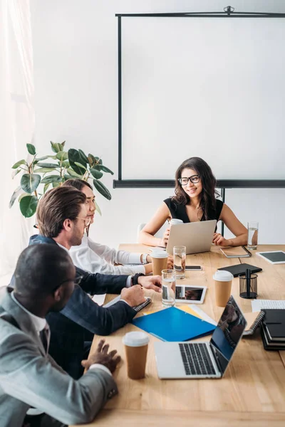 Multicultural business people having business meeting in office — Stock Photo