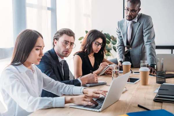 Multicultural young business people having business meeting in office — Stock Photo