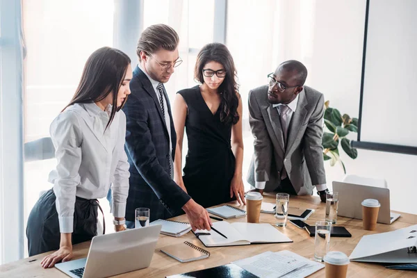 Multicultural young business people having business meeting in office — Stock Photo