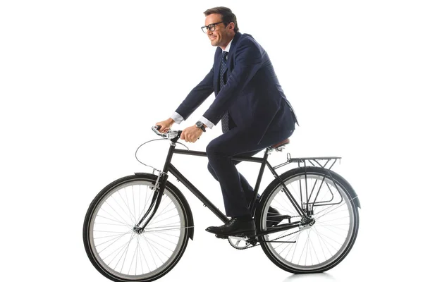 Homem de negócios sorridente em óculos andar de bicicleta isolada no fundo branco — Fotografia de Stock