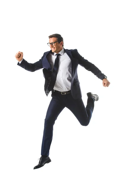 Excited businessman in eyeglasses jumping and gesturing by hands isolated on white background — Stock Photo