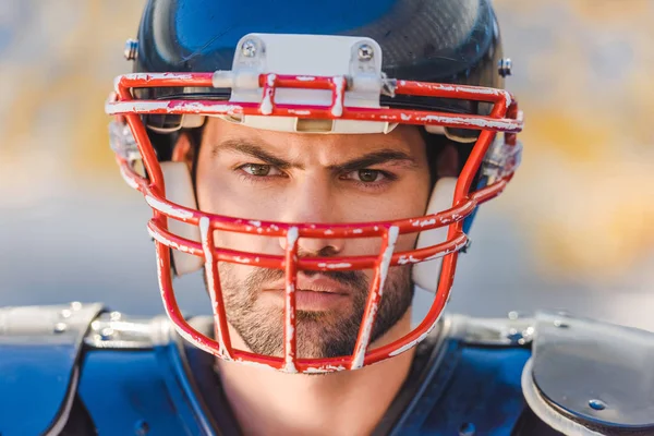 Close-up shot of angry young american football player — Stock Photo