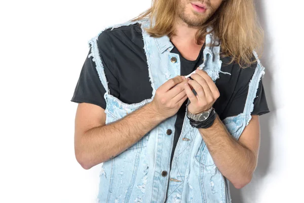 Cropped shot of young man rolling joint on white — Stock Photo