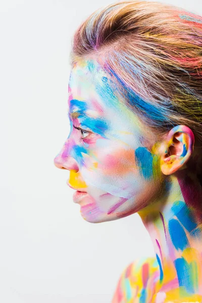 Vista lateral da menina atraente com arte corporal brilhante colorido isolado no branco — Fotografia de Stock