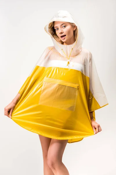 Beautiful woman posing in yellow raincoat isolated on white — Stock Photo