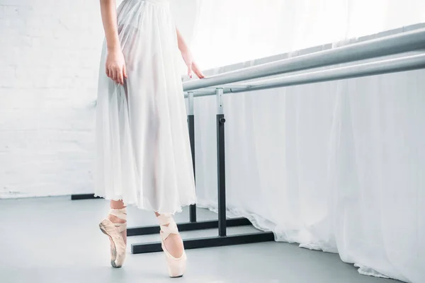 Cropped shot of elegant young ballerina practicing ballet in studio — Stock Photo