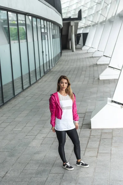 High angle view of attractive asian stylish female dancer standing at urban street — Stock Photo