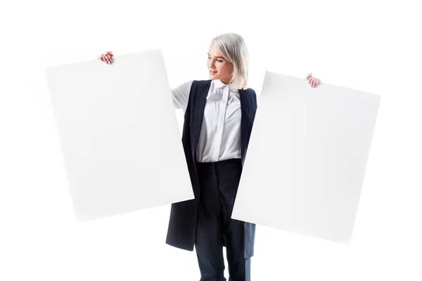 Young businesswoman holding empty banners isolated on white — Stock Photo