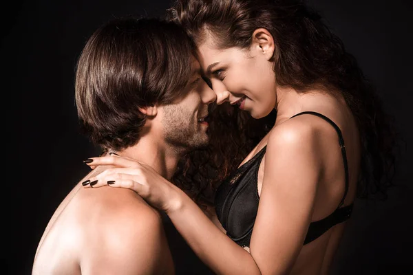 Side view of smiling shirtless couple standing face to face — Stock Photo