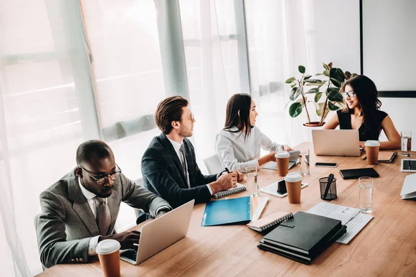 Multicultural business people having business meeting in office — Stock Photo