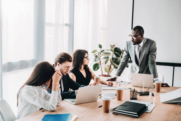 Multicultural business people having business meeting in office — Stock Photo