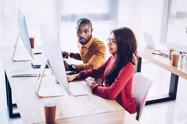 Side view of african american business people working on project together at workplace in office — Stock Photo