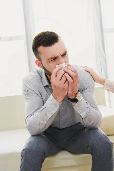 Depressed man crying in psychologist office — Stock Photo