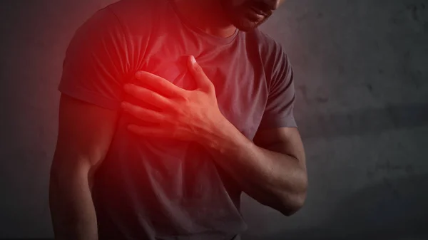 Cropped view of man having heart attack with red painful point — Stock Photo