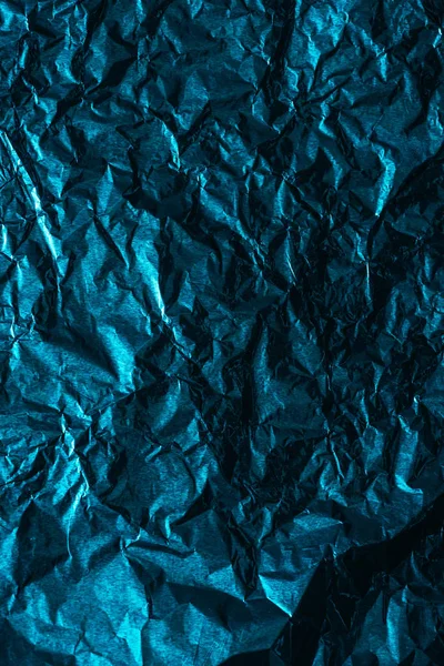 Schöne glitzernde abstrakte zerknitterte blaue Folie Hintergrund — Stockfoto
