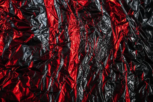 Beautiful shiny abstract crumpled silver and red foil background — Stock Photo