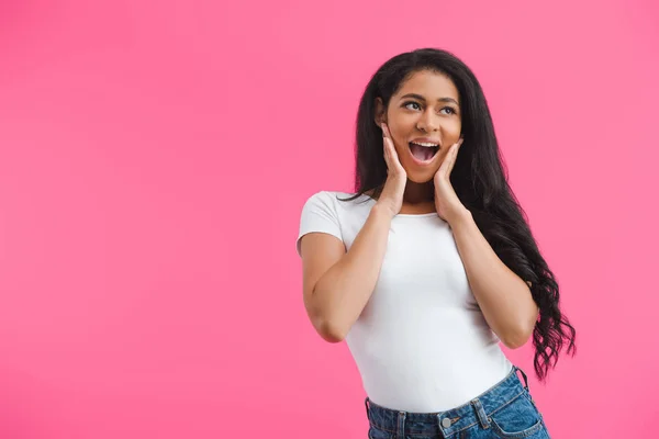 Portrait of excited young african american woman in casual clothing isolated on pink — Stock Photo