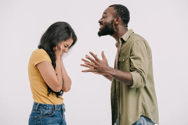 Side view of african american boyfriend screaming at girlfriend isolated on white — Stock Photo