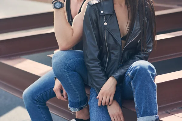 Cropped view of sexy couple sitting together — Stock Photo