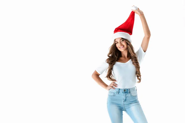 Bella elegante giovane donna in posa in rosso cappello di Babbo Natale, isolato su bianco — Foto stock