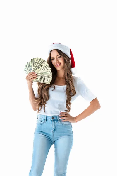 Belle fille dans santa chapeau tenant billets en dollars, isolé sur blanc — Photo de stock