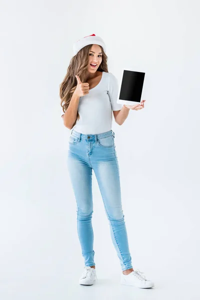 Beautiful girl holding tablet with blank screen and showing thumb up, isolated on white — Stock Photo