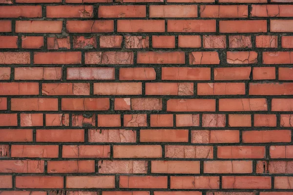 Vecchio muro di mattoni rosso intemperie, sfondo pieno telaio — Foto stock