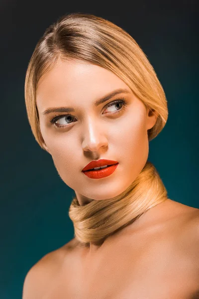 Portrait of attractive woman with red lips and blond hair over neck on dark backdrop — Stock Photo