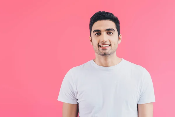 Portrait of smiling handsome man looking at camera isolated on pink — Stock Photo