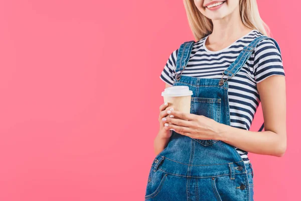 Cropped shot of woman with coffee to go isolated on pink — Stock Photo
