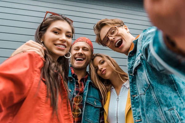 Cheerful stylish friends taking selfie together — Stock Photo