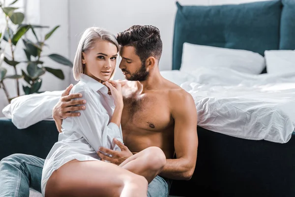 Passionate sexy couple cuddling in bedroom — Stock Photo