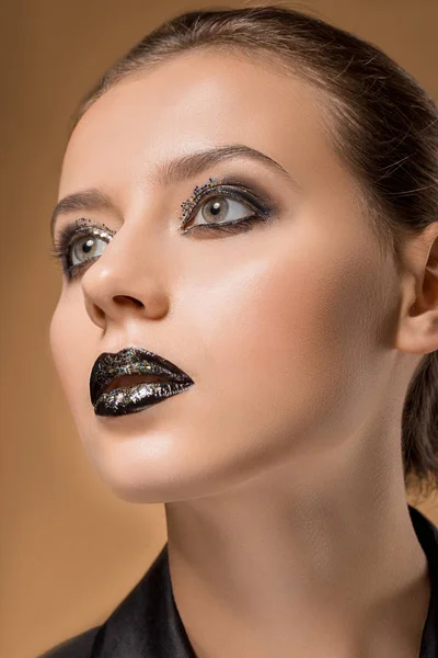 Close up of young beautiful woman with glittery makeup — Stock Photo