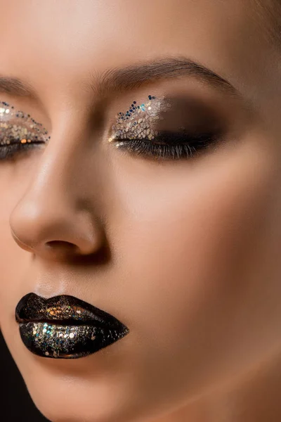 Close up of young beautiful woman with glittery makeup and closed eyes — Stock Photo