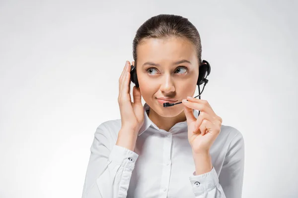 Young call center operator working in headset — Stock Photo