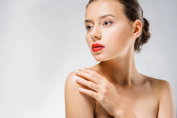 Young beautiful woman with red lips touching shoulder — Stock Photo