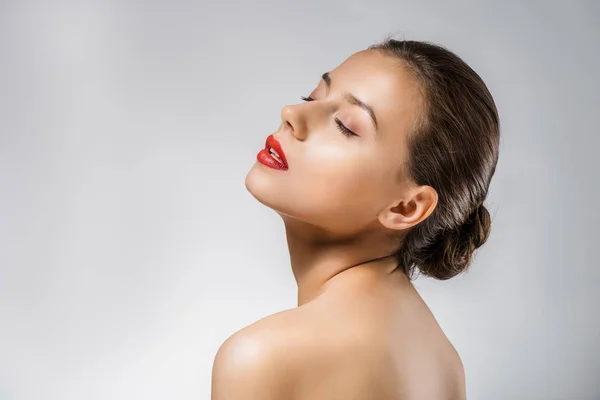 Young beautiful woman with red lips and closed eyes — Stock Photo