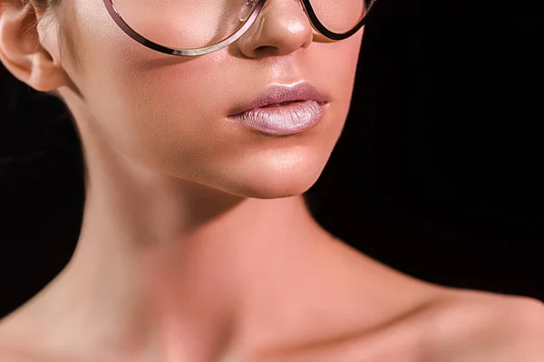 Cropped shot of woman with pink lipstick on lips isolated on black — Stock Photo